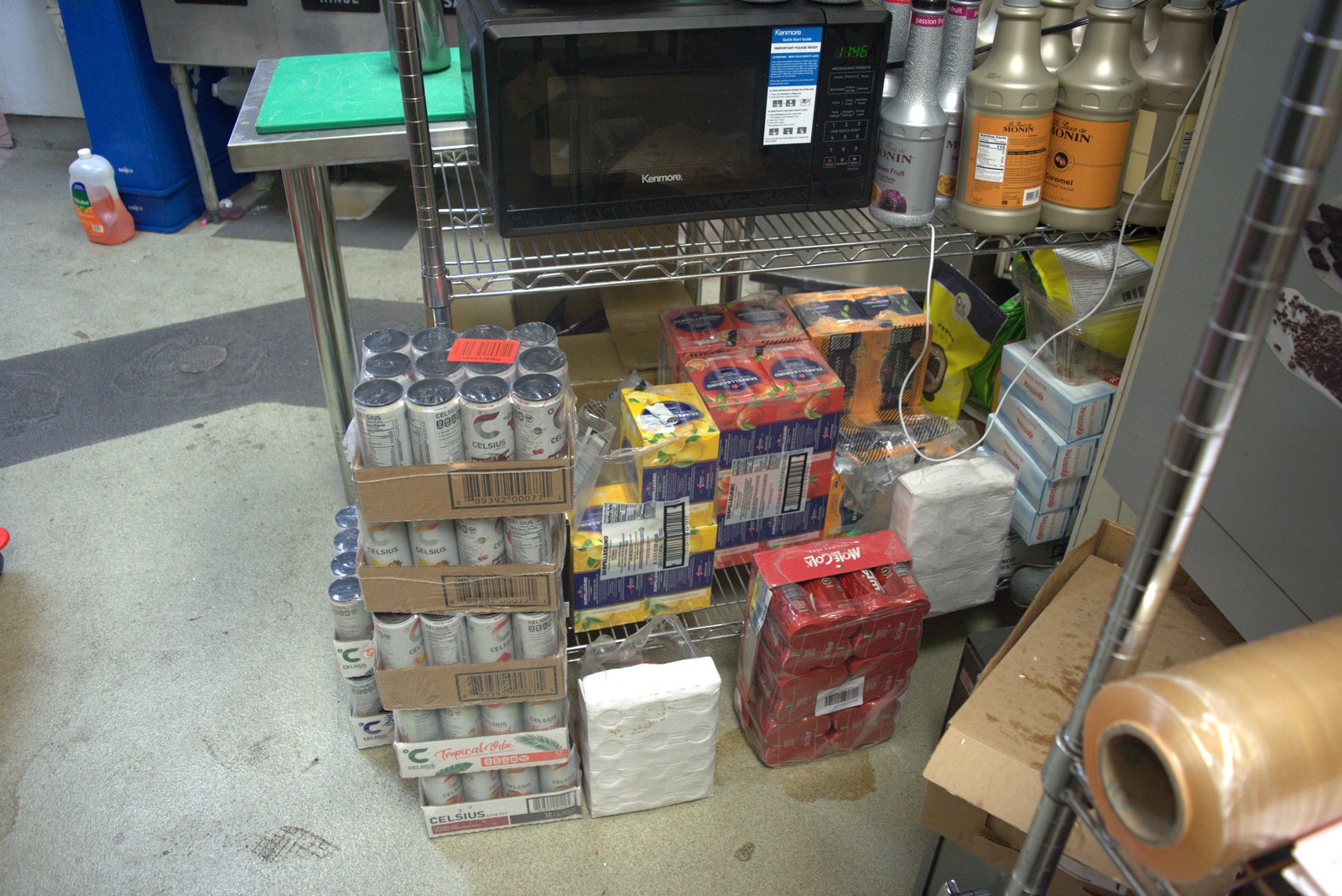 Floor storage of Celsius energy drinks, Sanpellegrino multipacks, Mole Cola and bulk paper towels — none of these are Qargo-approved SKUs