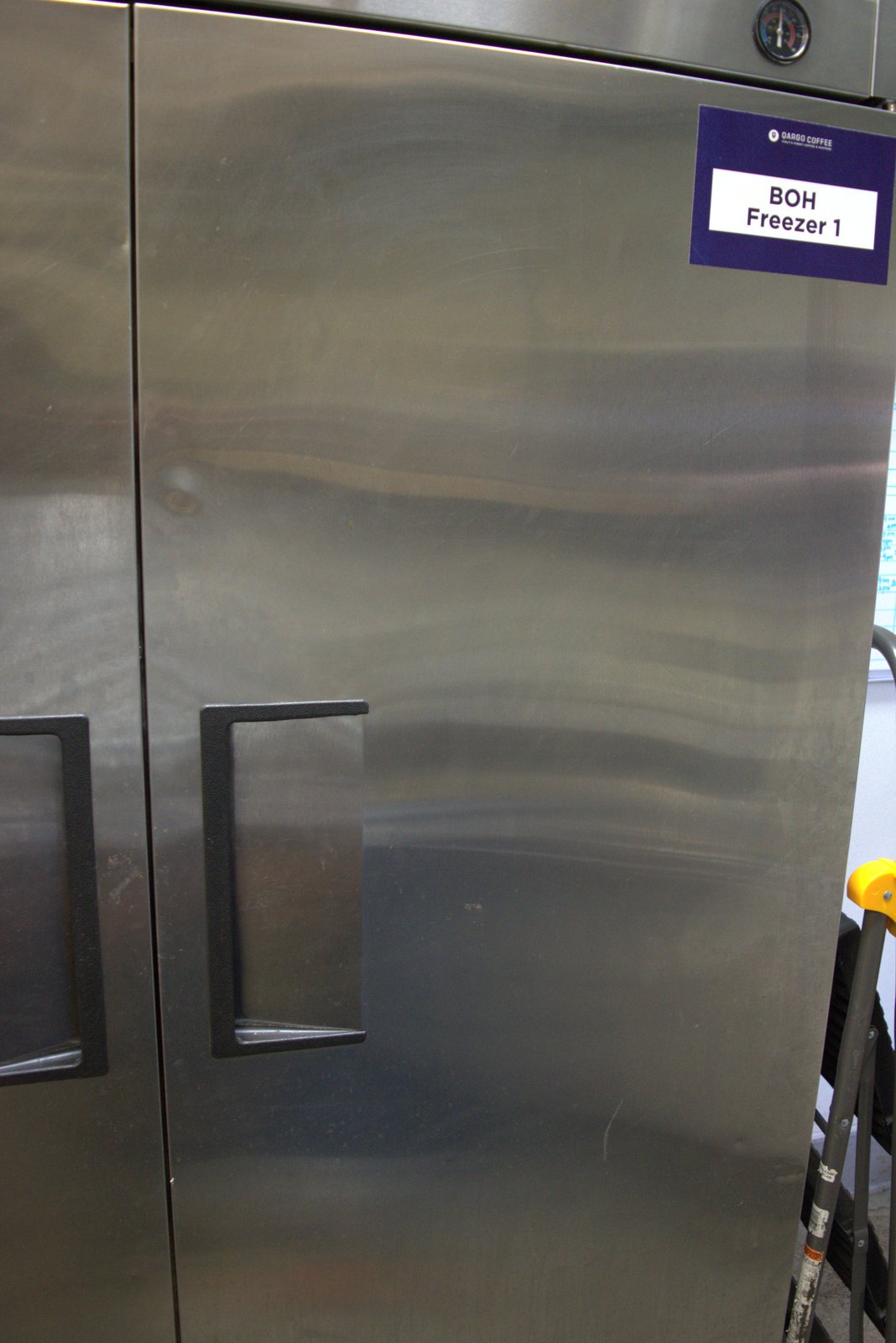 Official Qargo Coffee 'BOH Freezer 1' identification tag — confirming the preceding photographs are of the store's designated back-of-house freezer