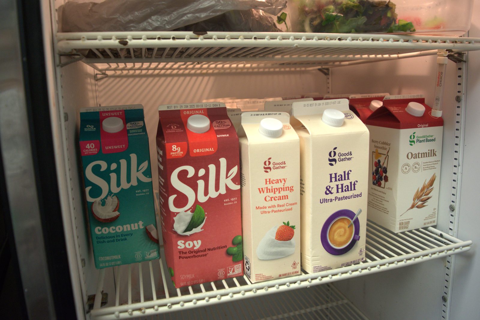 Walk-in fridge — full inventory of retail consumer dairy (Silk, Good & Gather) — none are Qargo-approved foodservice SKUs