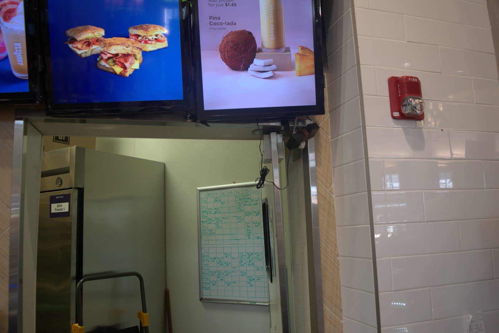 Customer-facing menu boards prominently feature 'LAVAZZA' branding at a Qargo Coffee store — direct competitor exposure to customers