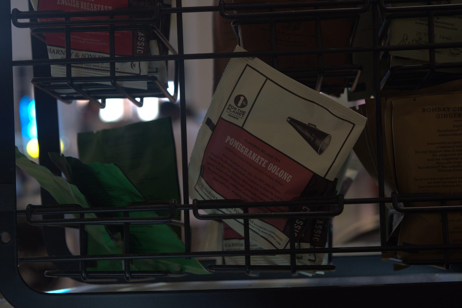 Front-of-house tea bar — Harney & Sons and Revolution Tea unauthorized retail-grade tea brands instead of the Qargo program